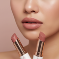 Model wearing Christian Beauty Co Velvet Tips matte lipstick in a soft dusty rose nude-pink shade